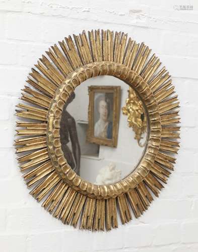 A Spanish giltwood sunburst wall mirror