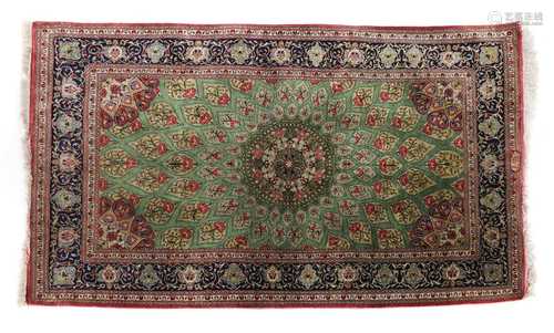 A Persian silk rug,