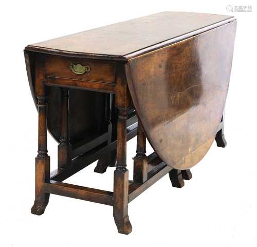 A yew double gateleg drop-leaf table,