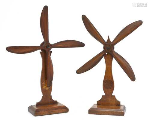 A pair of carved wooden whirligig mantel ornaments,