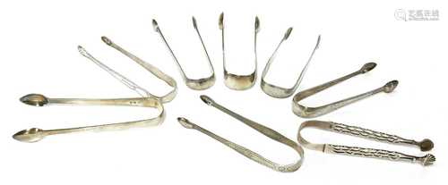 Eight pairs of silver sugar tongs,