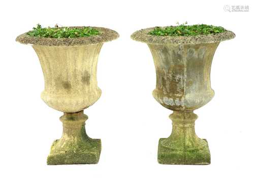 A pair of composite stone campana garden urns,