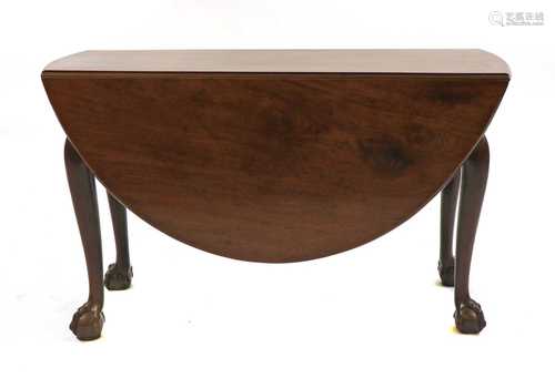 A mahogany drop-leaf dining table,