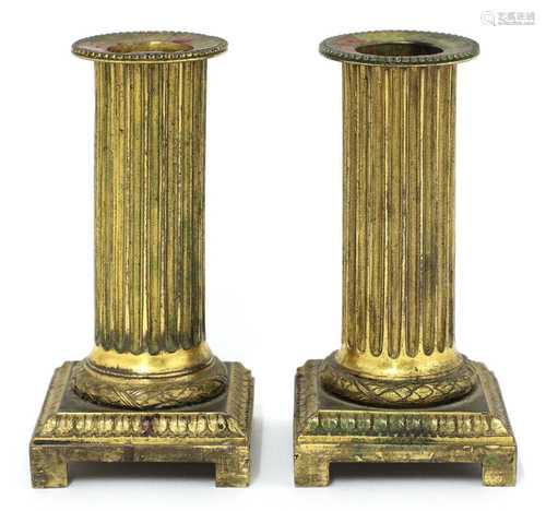 A pair of gilt bronze candlesticks,