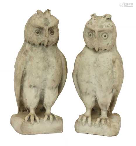 A pair of carved marble owls