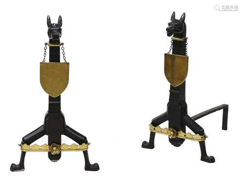 A pair of wrought iron and brass firedogs in the manner of R...