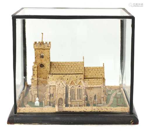 A cork model of a church and churchyard,