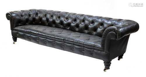 A large buttoned leather chesterfield sofa,