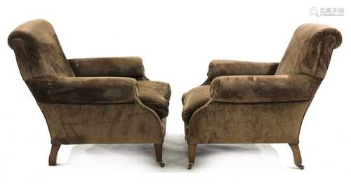 A pair of easy armchairs,