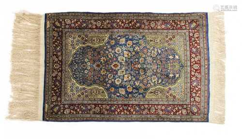 A Turkish silk and metal Hereke rug,