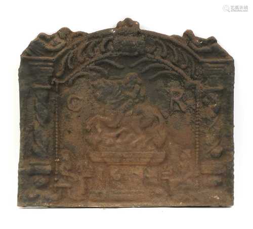 A cast-iron fire back,