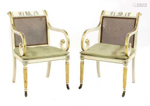 A pair of George III-style painted bergère chairs,