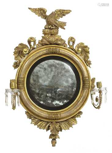 A giltwood convex wall mirror,