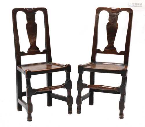 A pair of George I elm side chairs,