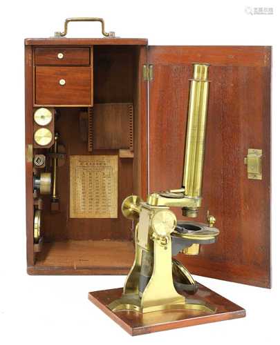 A brass monocular microscope,