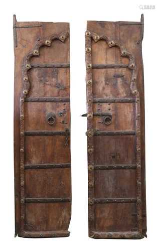 A pair of Indian Rajasthani carved hardwood doors,