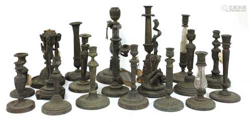 A collection of twenty candlesticks,