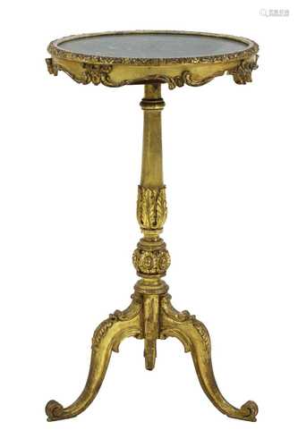 A carved giltwood tripod table,