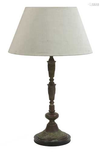 A patinated metal table lamp and shade,