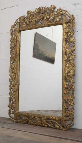 A large 'faux bois' carved, giltwood gesso wall mirror,