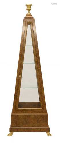 A contemporary obelisk display cabinet,