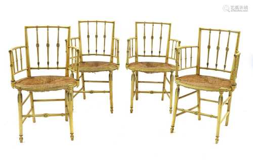 A set of four painted Regency-style elbow chairs