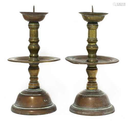 A pair of bronze Heemskerk-type candlesticks,