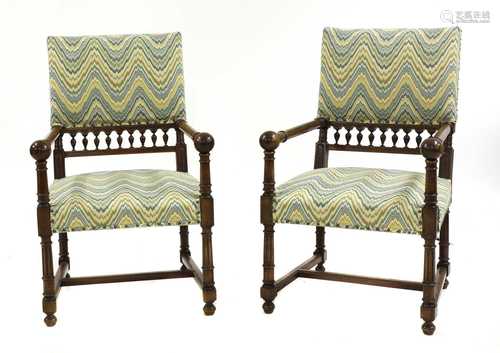 A pair of walnut armchairs,