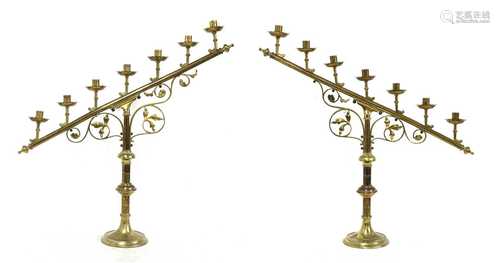 A pair of brass ecclesiastical candlesticks