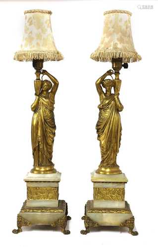 A pair of neoclassical ormolu table lamps,