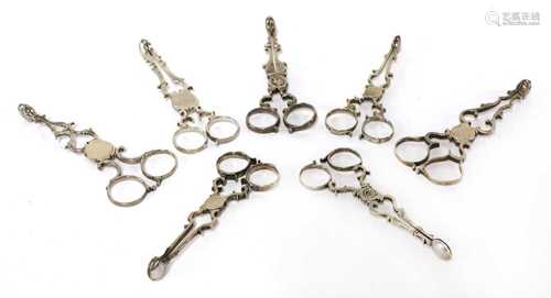 Three pairs of silver scissor-action sugar nips,