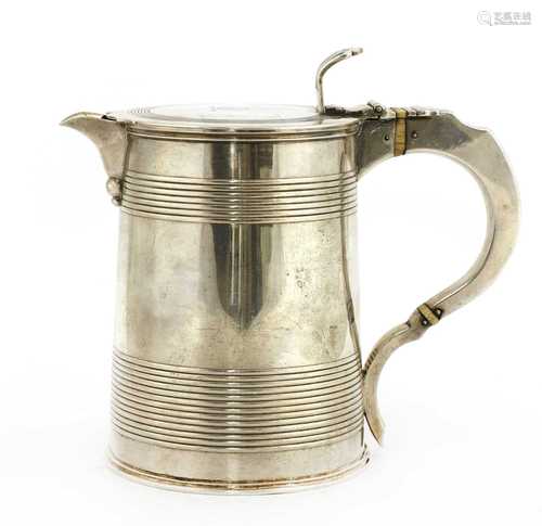 A George III silver lidded jug,