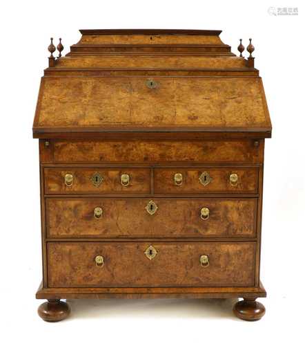 A walnut and feather banded bureau