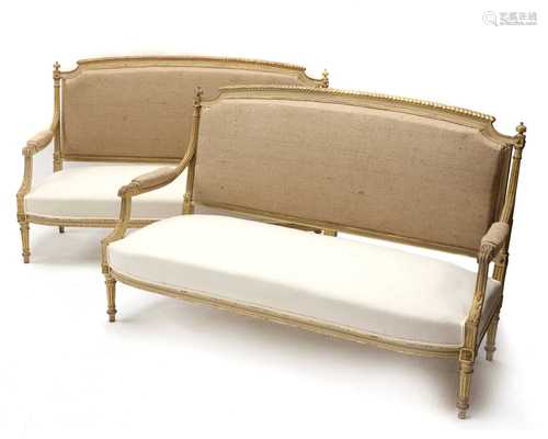 A pair of French Louis XVI-style painted and parcel-gilt set...