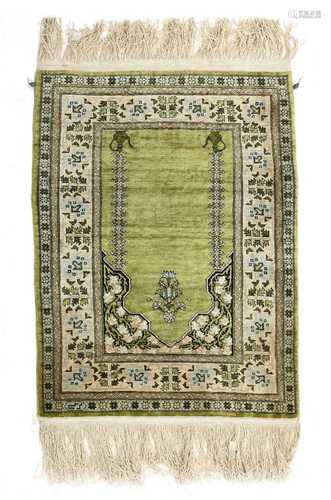 A small Turkish Hereke and gold-coloured metal rug,