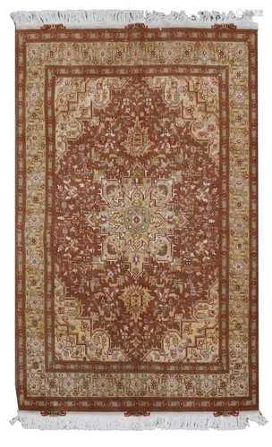 A fine Persian silk inlaid Tabriz rug,