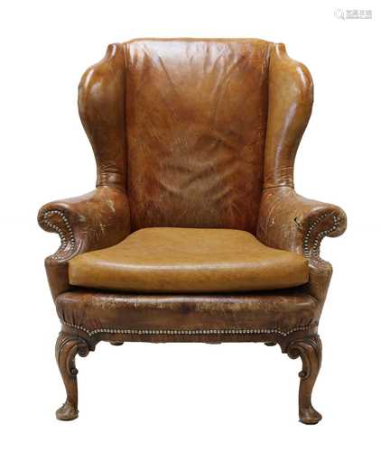 A Queen Anne-style leather wingback armchair,