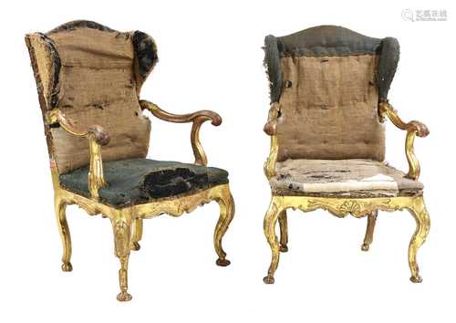 A pair of Italian carved giltwood wingback open armchairs,