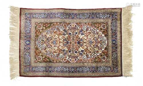 A Turkish silk and metal Hereke rug