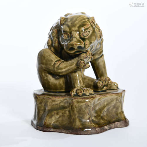 A Celadon-glazed Porcelain Lion Ornament