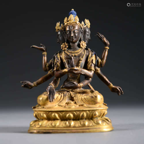 A Gilt-bronze Statue of   Three-head Six-arm Bodhisattva