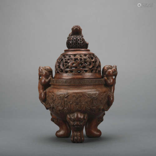 A wood incense burner