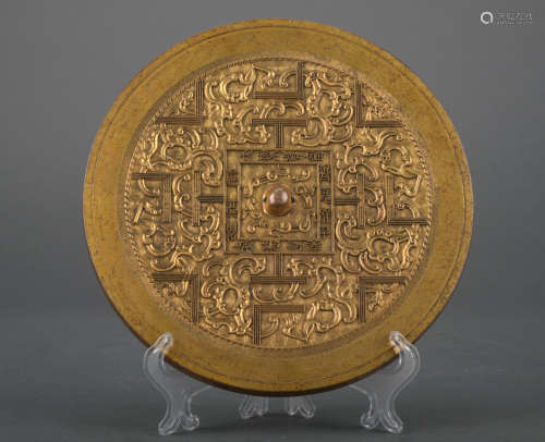 A gilt-bronze mirror