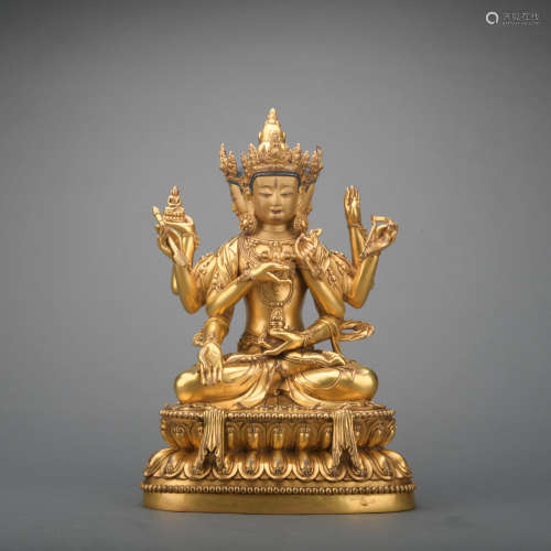 A gilt-bronze statue of Eight armed Guanyin