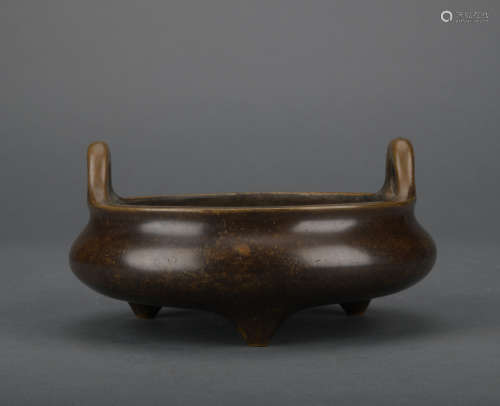 A bronze incense burner