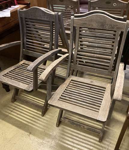 A set of six weathered teak folding garden chairs, two with ...