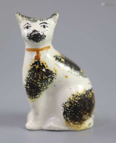 A Staffordshire pottery cat with yellow collar, mid 19th cen...