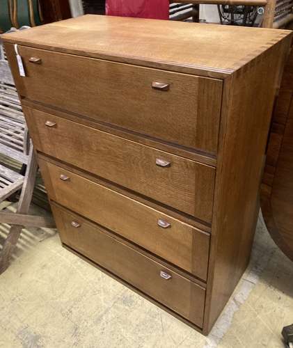 A mid century Cotswold School four section oak drop leaf cab...