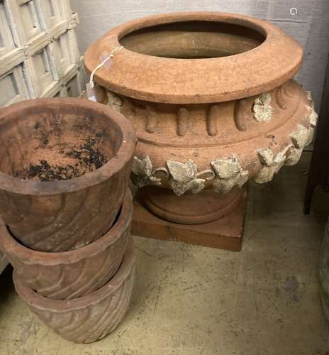 A circular terracotta garden planter on stand, diameter 56cm...