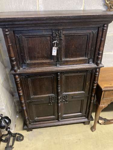 A 17th century style oak cupboard, width 100cm depth 42cm he...